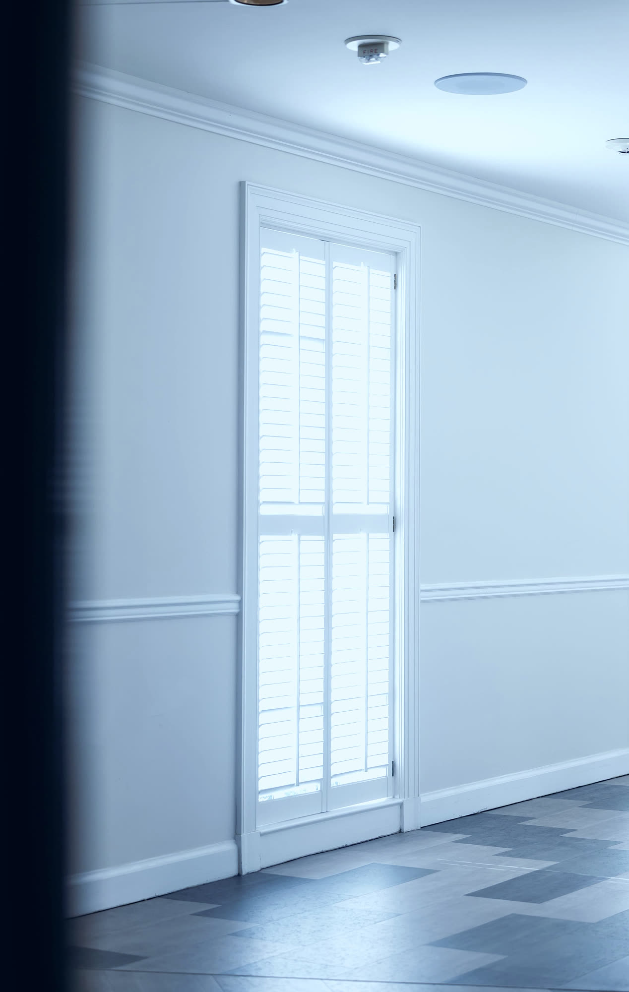 Boutique hotel guest rooms with tunable lighting and motorized solar shades